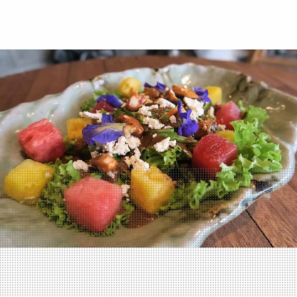 A simple (and beautiful!) salad of watermelon, arugula, kesong puti, edible flowers and pili nuts dressed in balsamic vinaigrette.