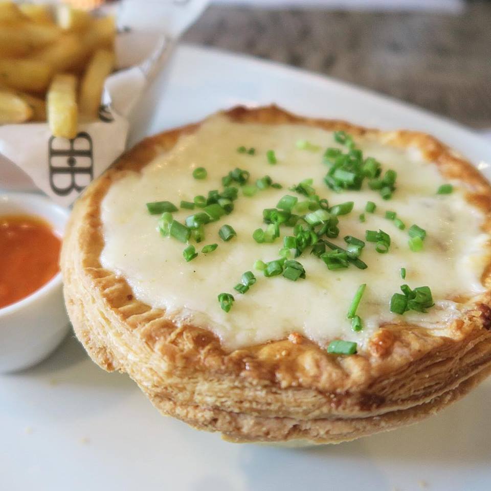 The Aussies know their meat pies - this one made with stewed beef and with a spot of cheese melted on top! 😁 #BondiAndBourke