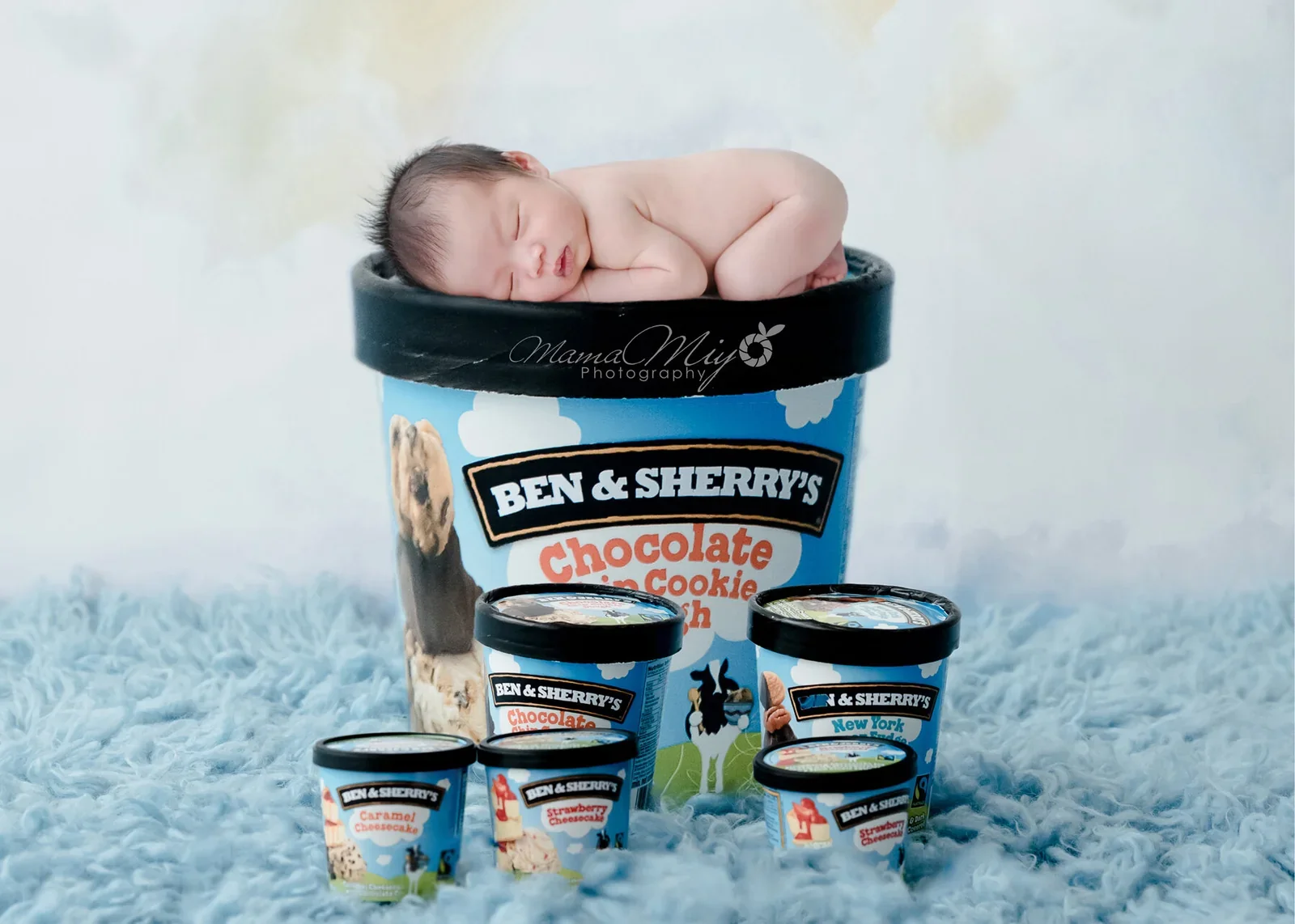 Newborn posed on an ice cream tub in a playful digital art portrait