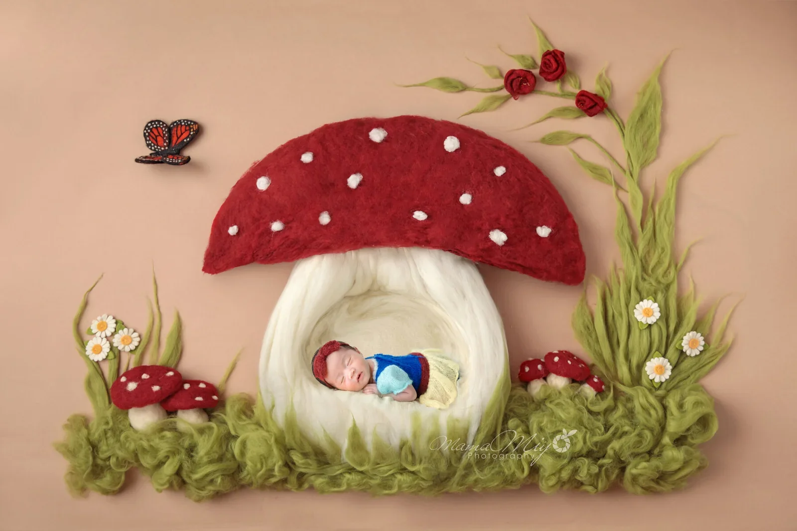 Newborn resting inside a red mushroom house in a digital woodland scene
