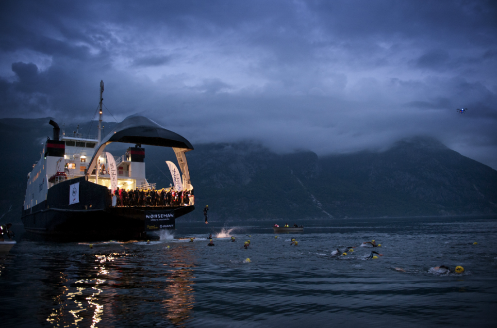 T he Norseman swim starts from the loading bay of a car ferry, through the water of the Hardangerfjord fjord to the local town, Eidfjord .
