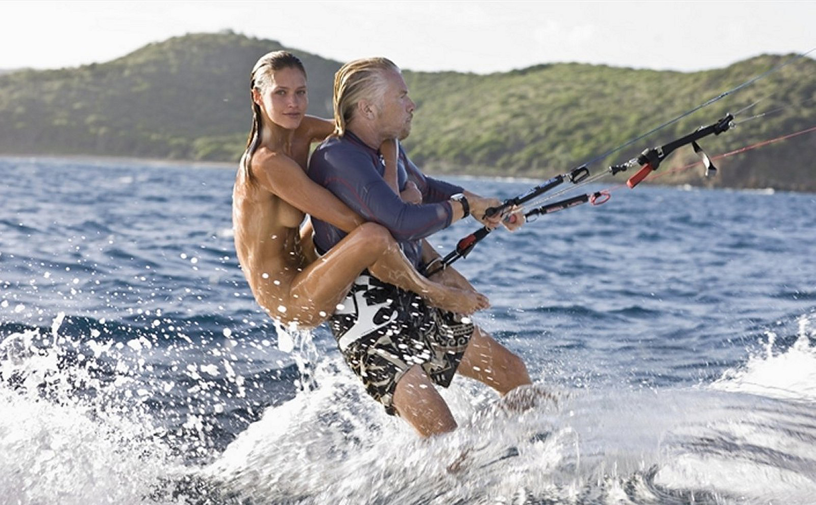 To train our core most of us use free weights while others prefer to kitesurf with naked supermodels on their back. Legend Sir Richard Branson kitesurfing with a naked supermodel on his back.