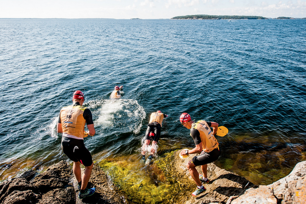Other competitors entering the water for their swim to one of the 26 islands they need to cross