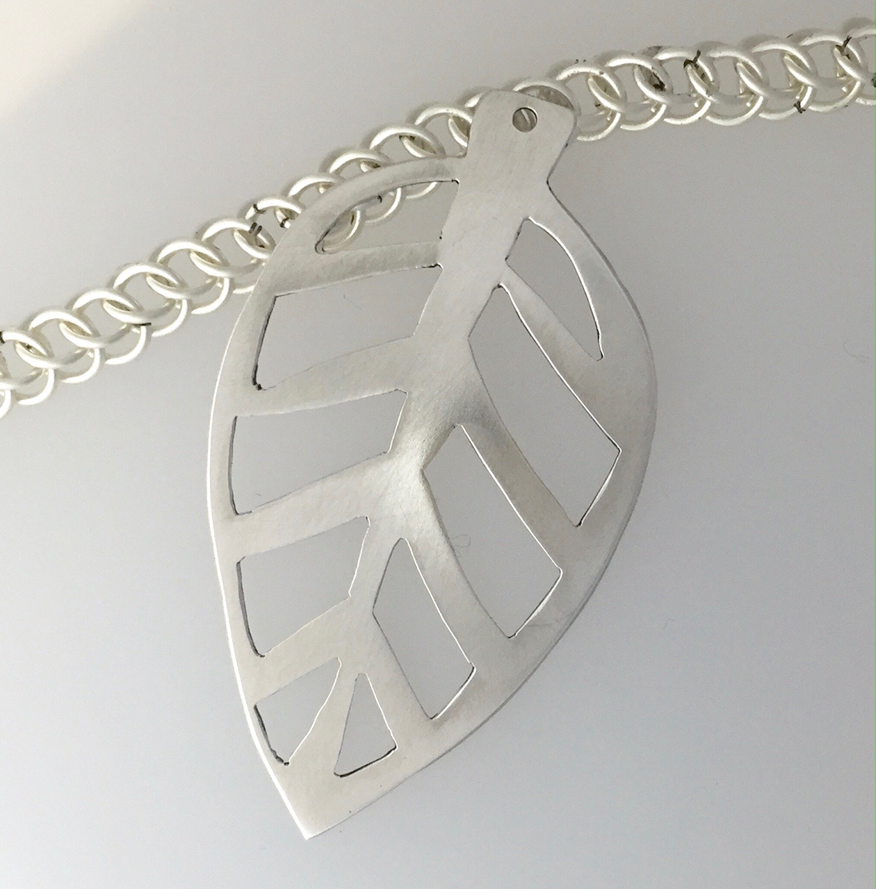 Pierced (sawed) silver leaf pendant