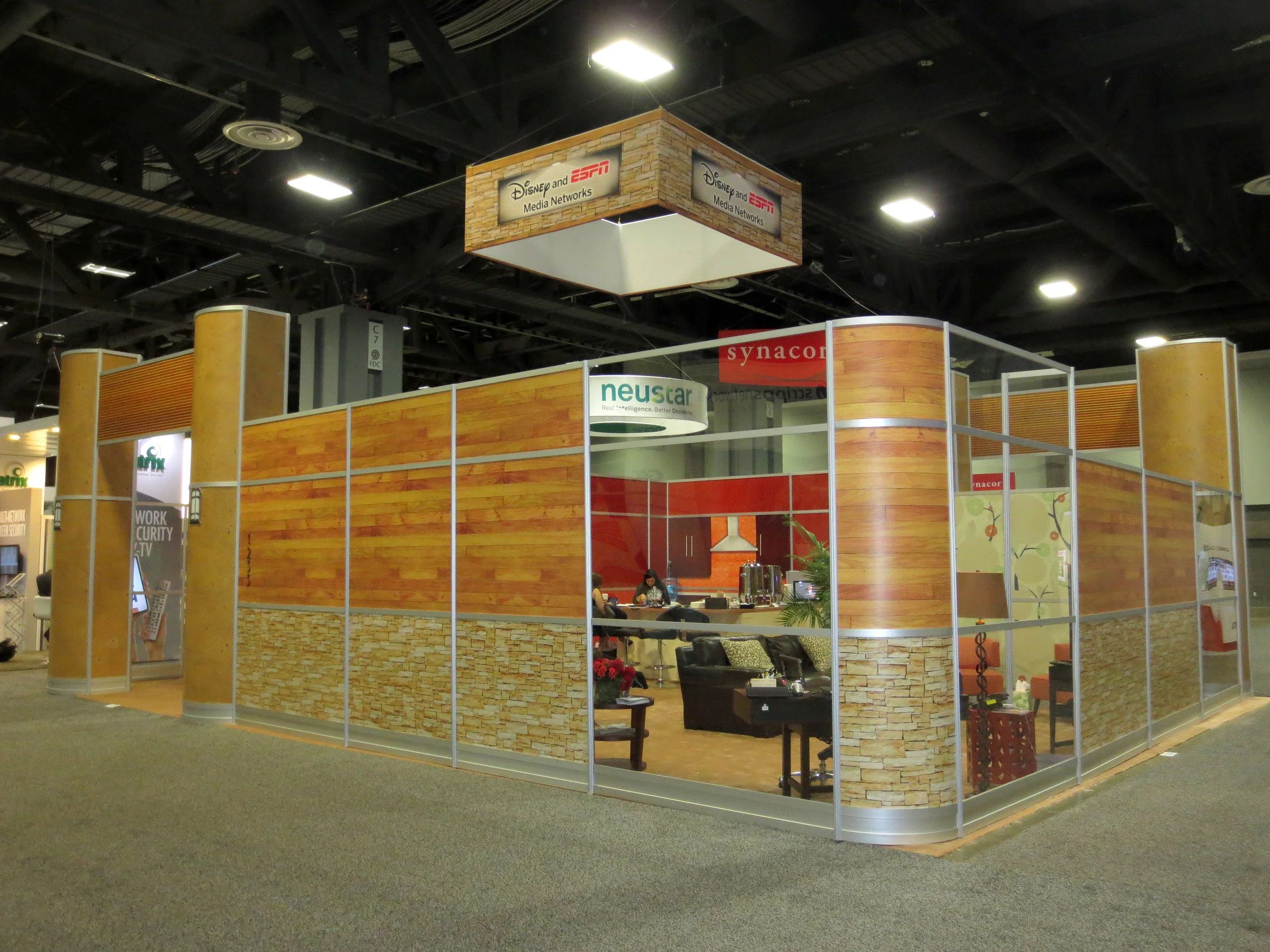   2013 NCTA Cable Show booth for Disney and ESPN Media Networks, final creative proposal and event photographs shown.   The idea behind this trade show display was to take an octanorm booth in a predetermined configuration and make it look as much li