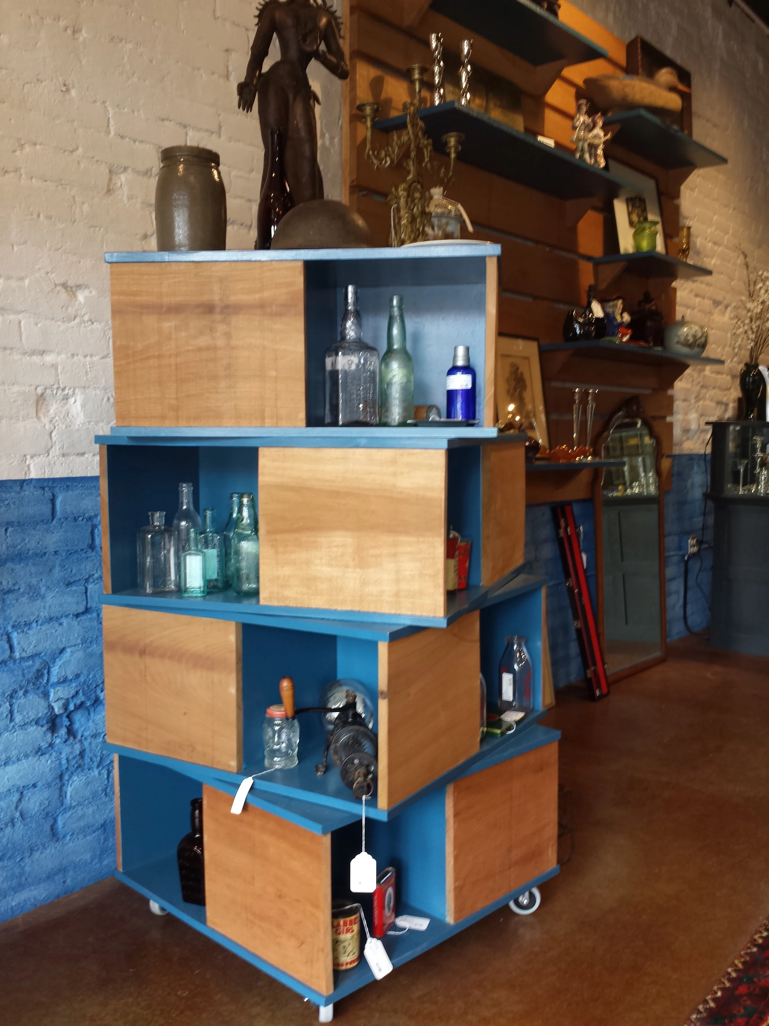  this modular stacked cube tower and its companion barnwood slat wall shelving unit were designed as prototype&nbsp;display pieces for LOppleman's store in Staunton, VA. The idea was to create a simple piece that could be easily produced in quantity 