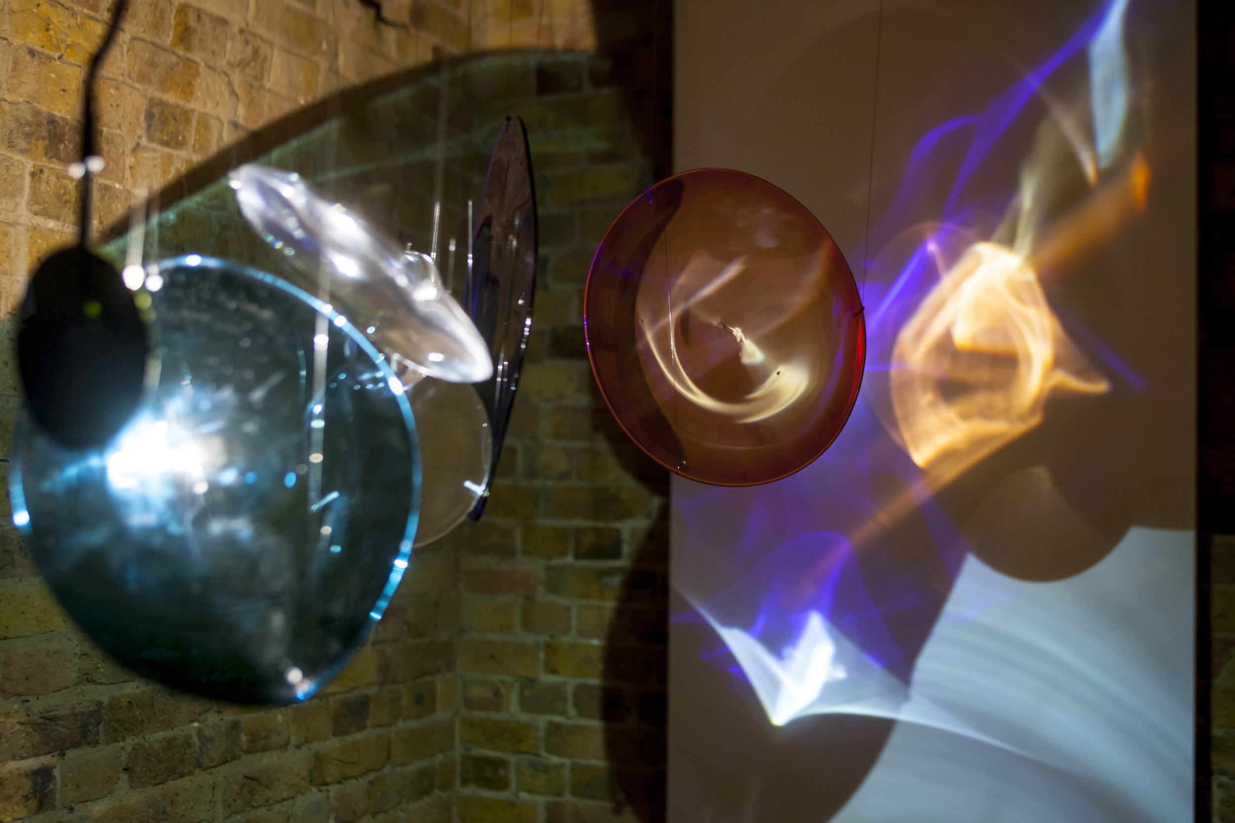 Light Paintings. Suspended hand blown glass lenses, steel, monofilament, halogen lights. 2015.