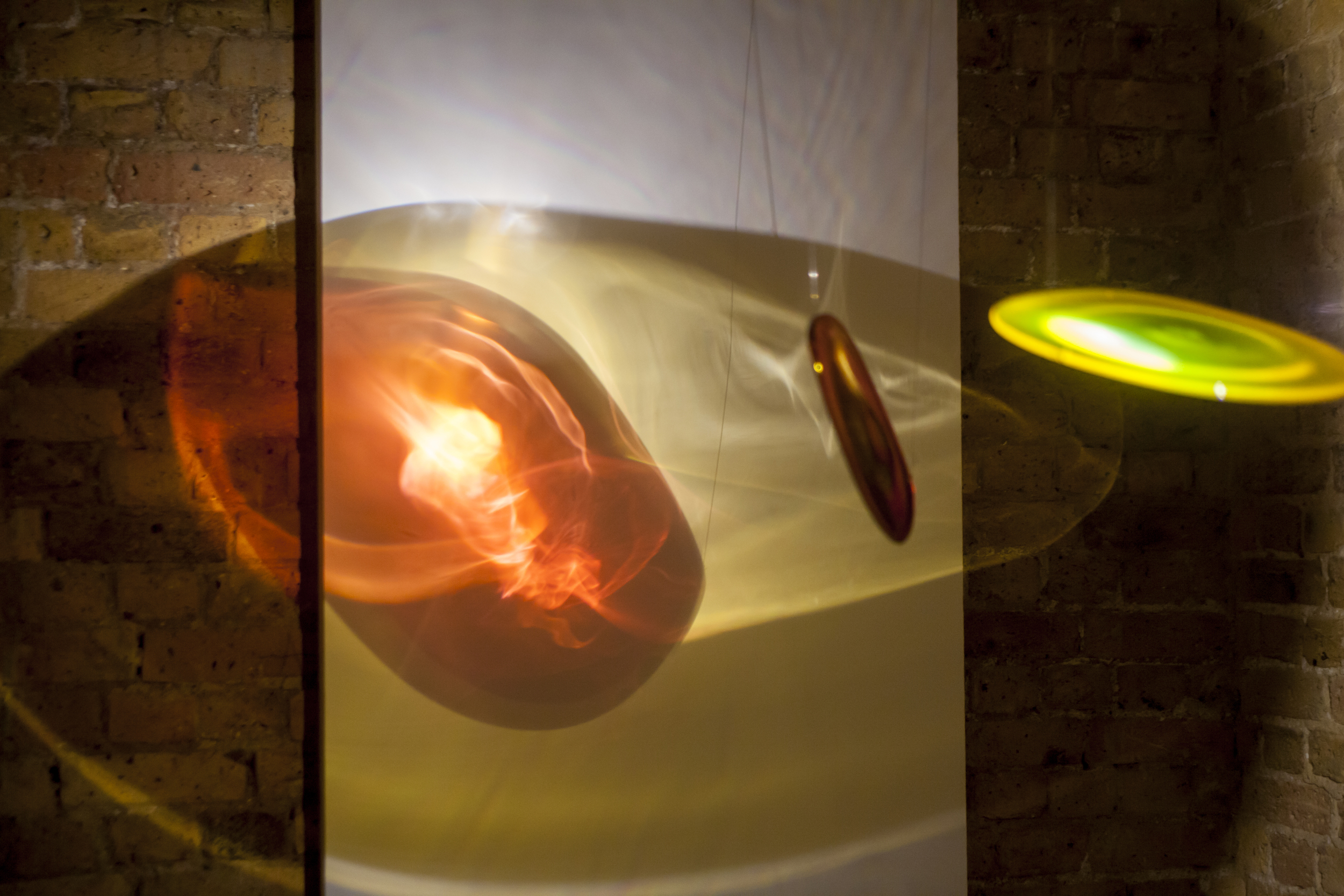 Light Paintings. Suspended hand blown glass lenses, steel, monofilament, halogen lights. 2015.