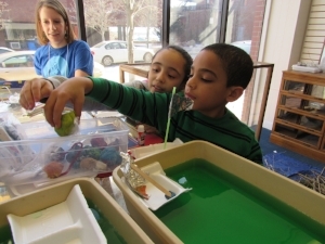 Emily getting kids excited about creating boats that float and move swiftly