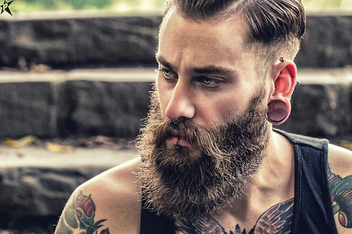 This man has decided to trim his beard into waves and continue to grow a lengthy mustache. It just looks odd!