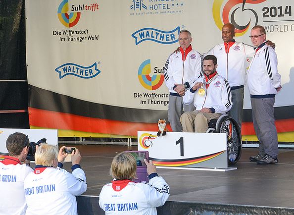 Matt Skelhon celebrates his Gold medal with Robin Taylor, Pasan Kularatne and Mike Babb