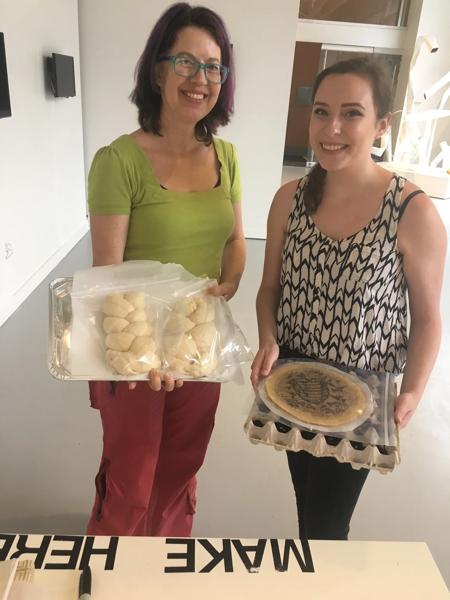 Workshop participants showing off their food wraps and their bread processed during the workshop.