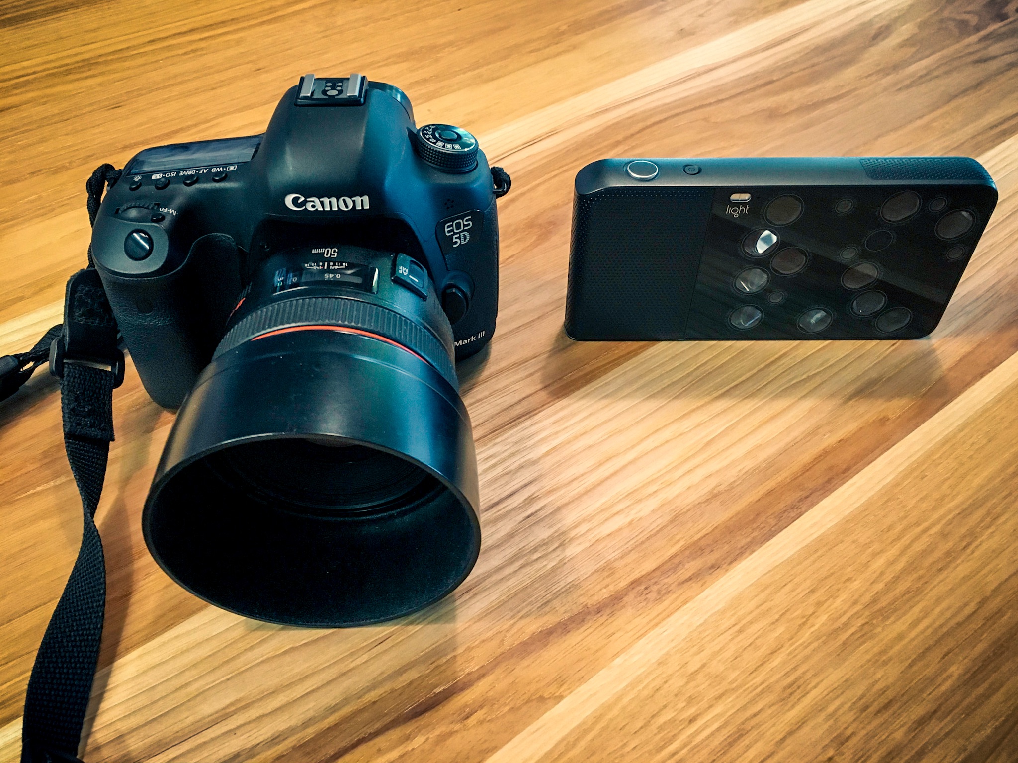 Light claims the L16 (mockup shown here on the right) will do everything the full-frame Canon 50mm F1.2 rig on the left does, and more.