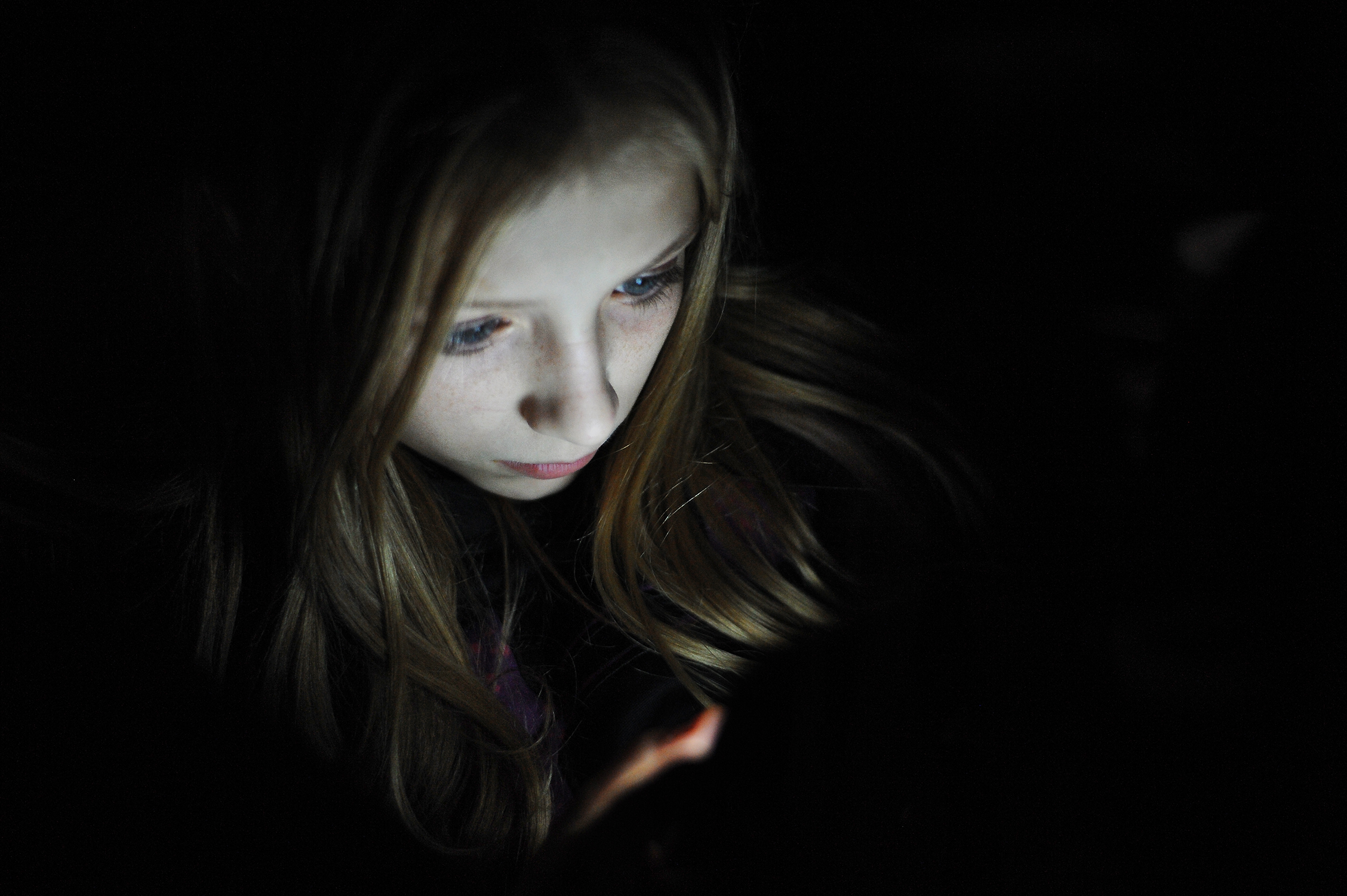 Chloe Tool browses on her mobile phone.