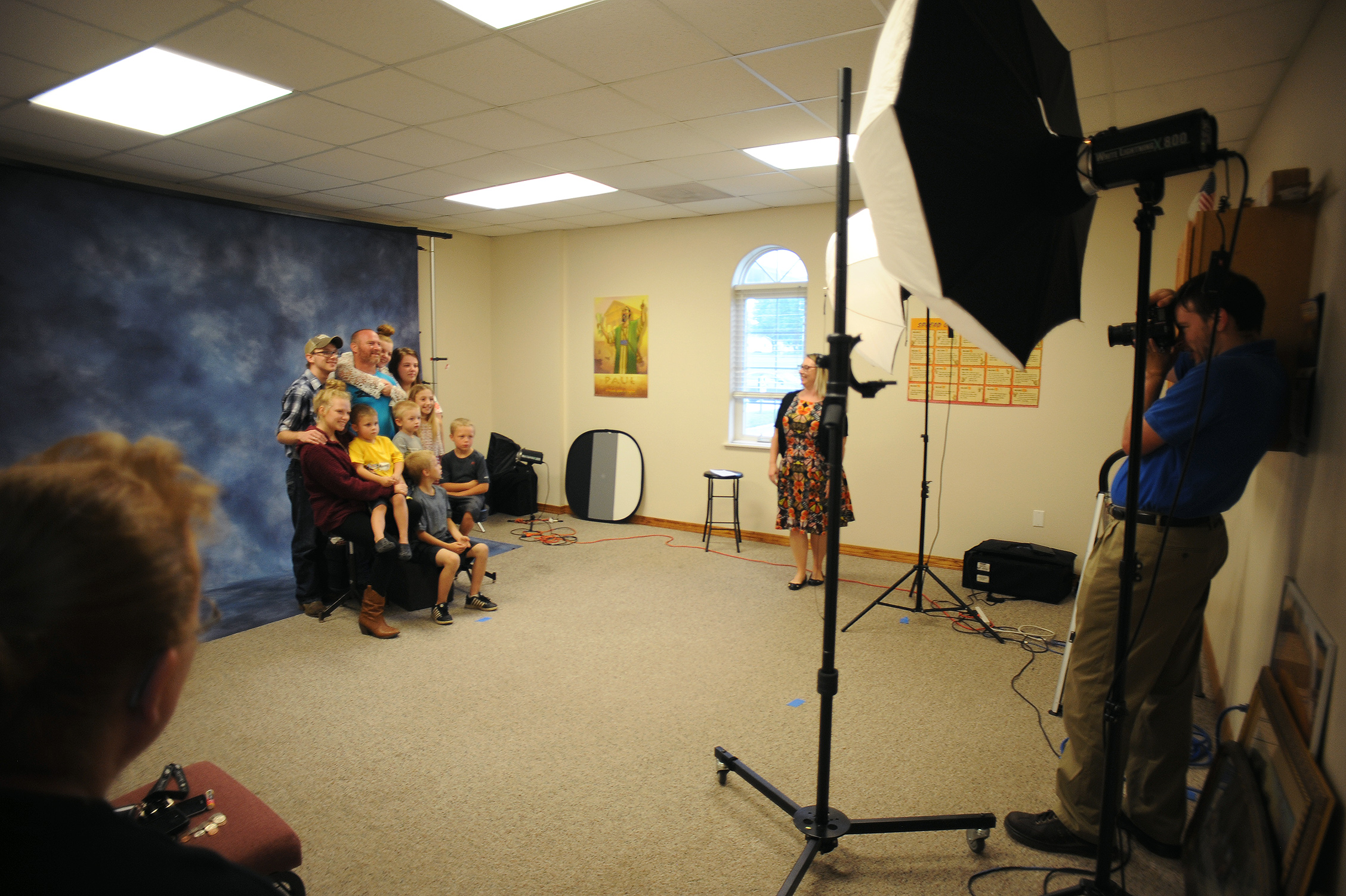 Tool family takes group shot at on of the rooms at Church of the Nazarene for their annual parishioners book.