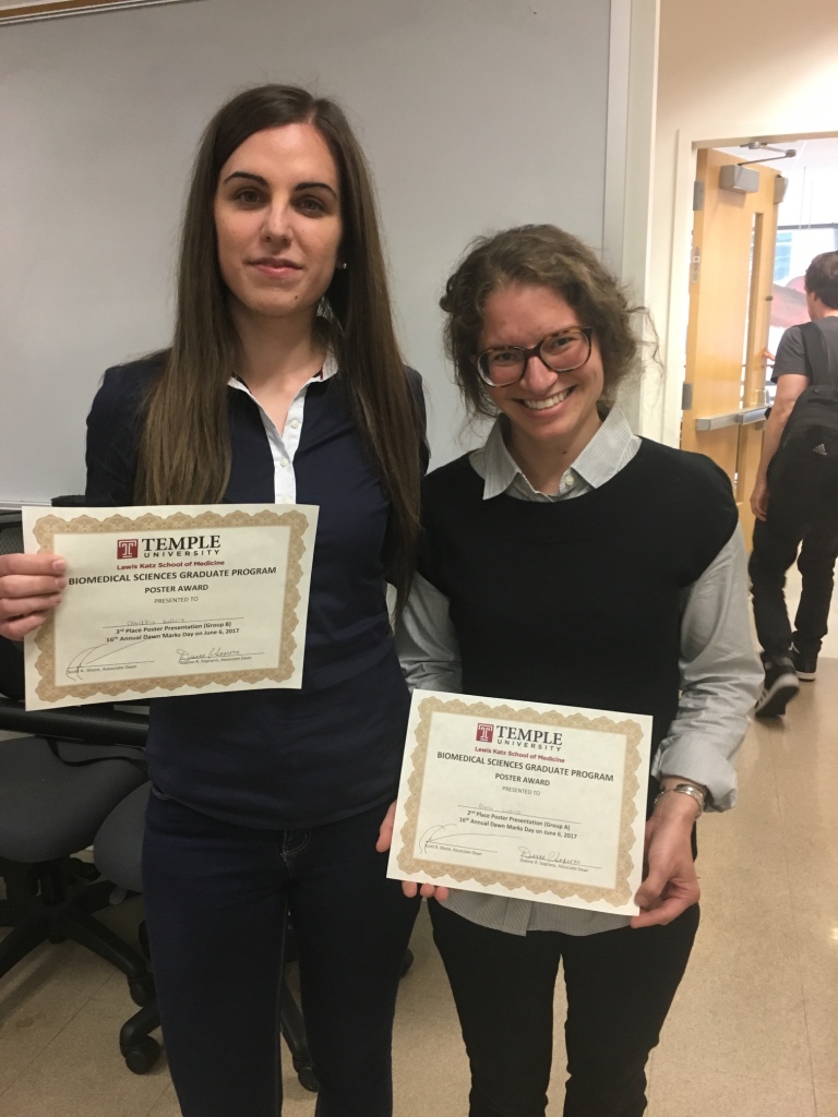 Alyssa, right, with her award. 
