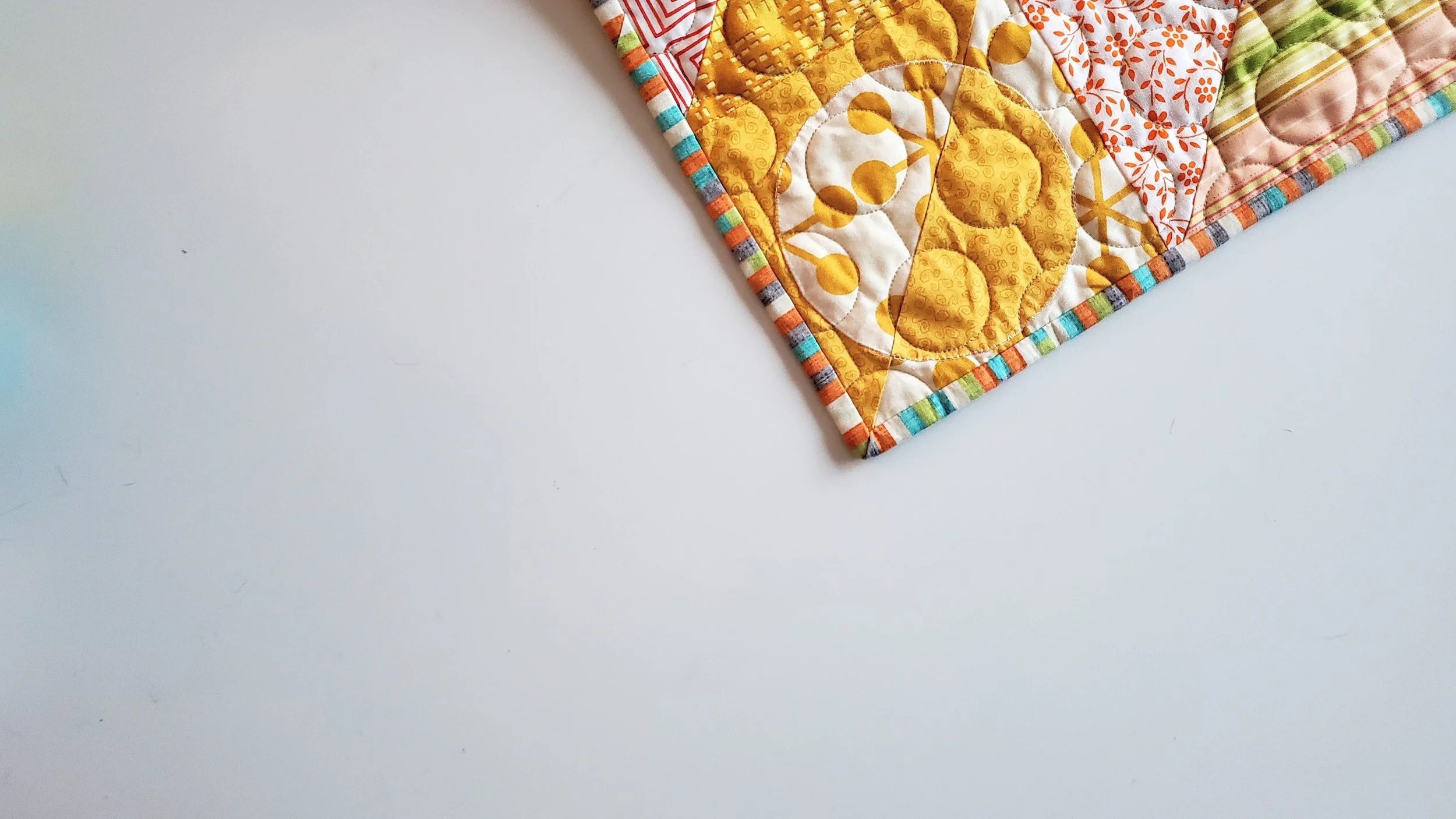 Elodie - A Bold Quilt of Half Square Triangles and Circles