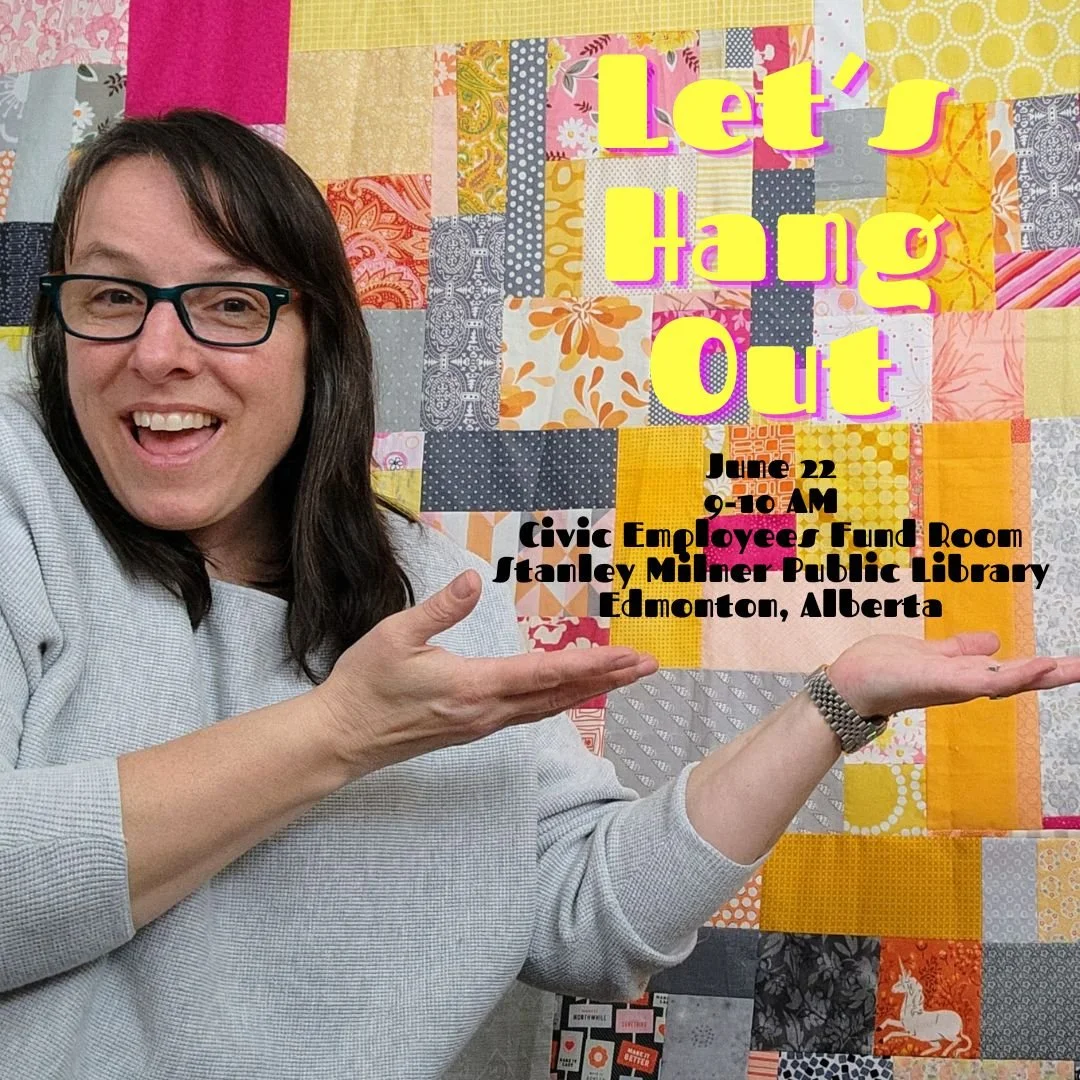 Cheryl Arkison in front of a quilt top