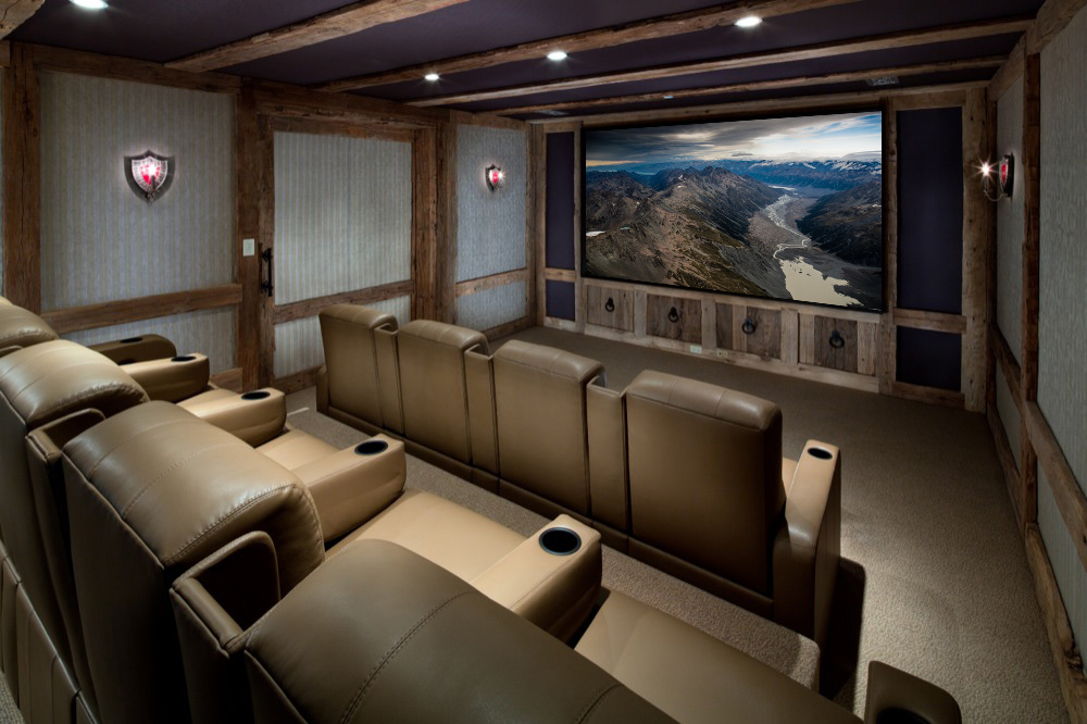 Large home theater with brown leather chairs.