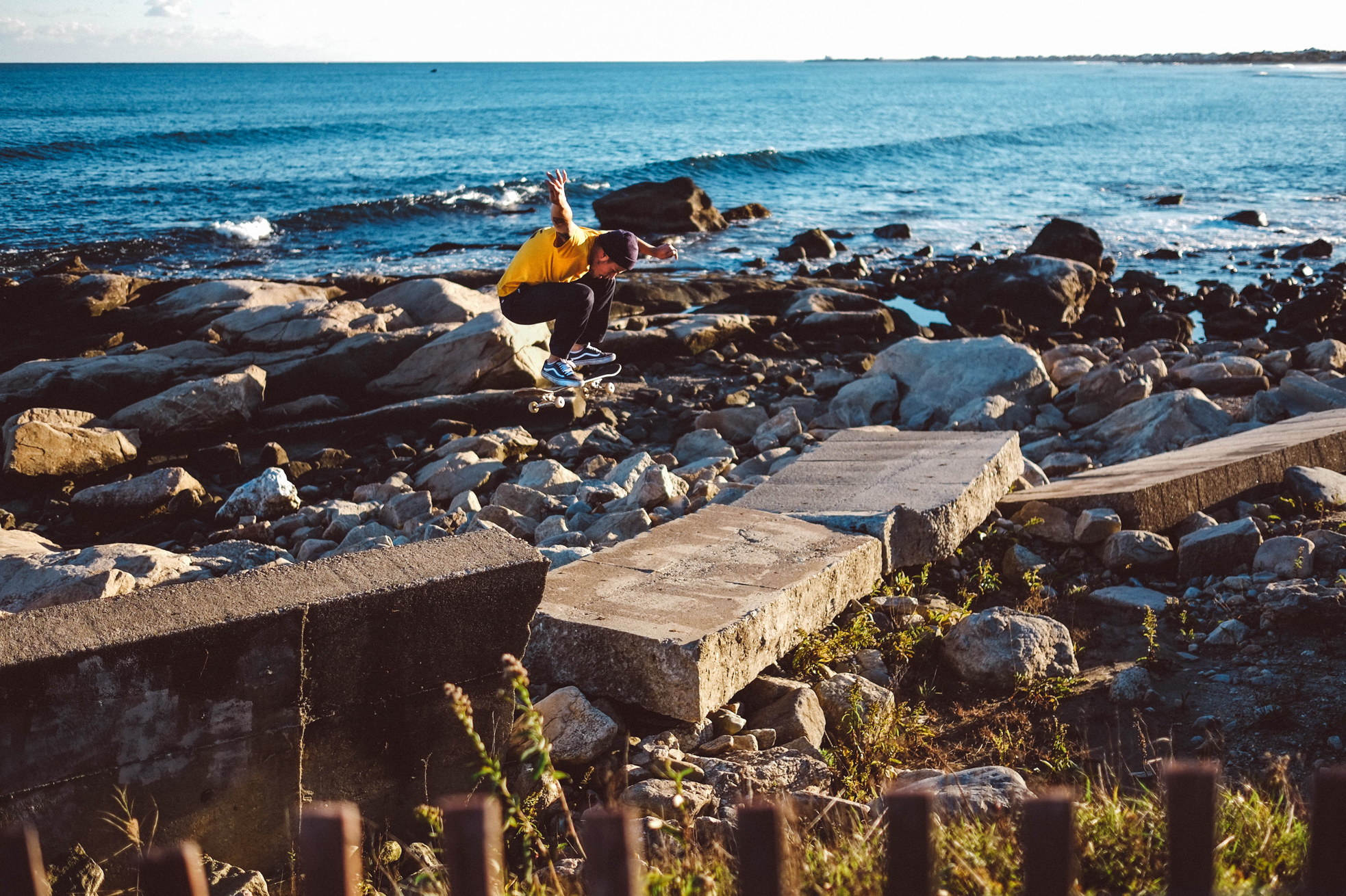 Justin, Black Point RI As the tides come in and out the old wall is shifted like boats in a bathtub. Justin visited this piece of coastline many times before the blocks were laying just right. While waiting for breaks in the wind he paced up and down the narrow wall. The rough, weather battered blocks offered no solitude. As Justin rode away the tides began their journey back in.