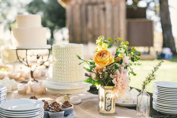 Wedding Centerpiece with garden roses antique tins and herbs