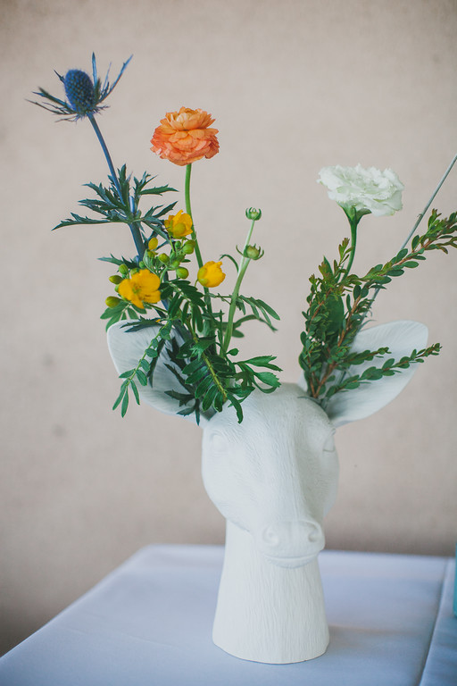 Eclectic look of wildflowers, ranuculus in deer head