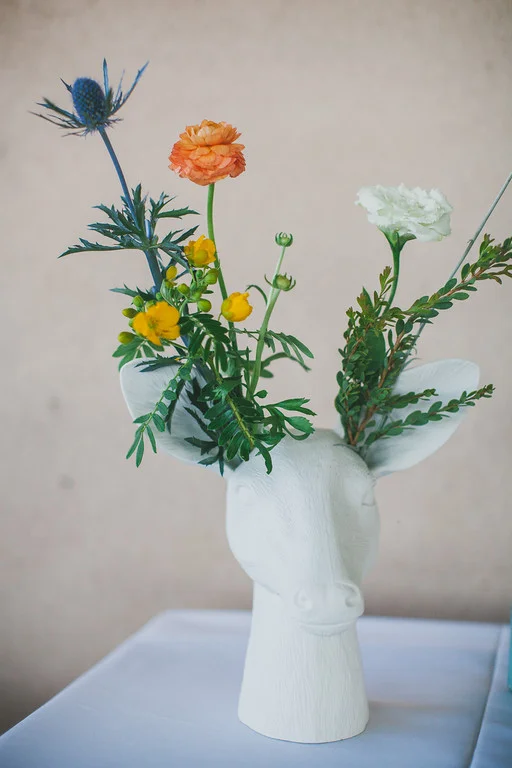 Eclectic look of wildflowers, ranuculus in deer head