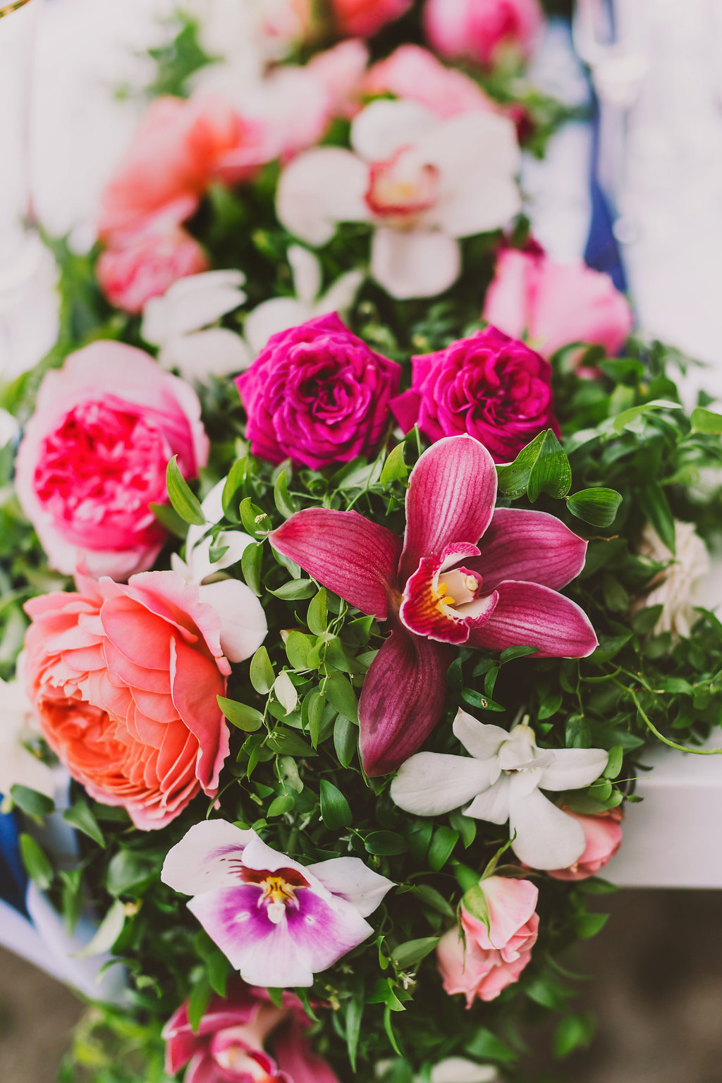 Tablescape of garden roses and orchids