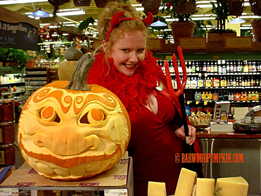 My lovely wife modeling a pumpkin at Whole Foods
