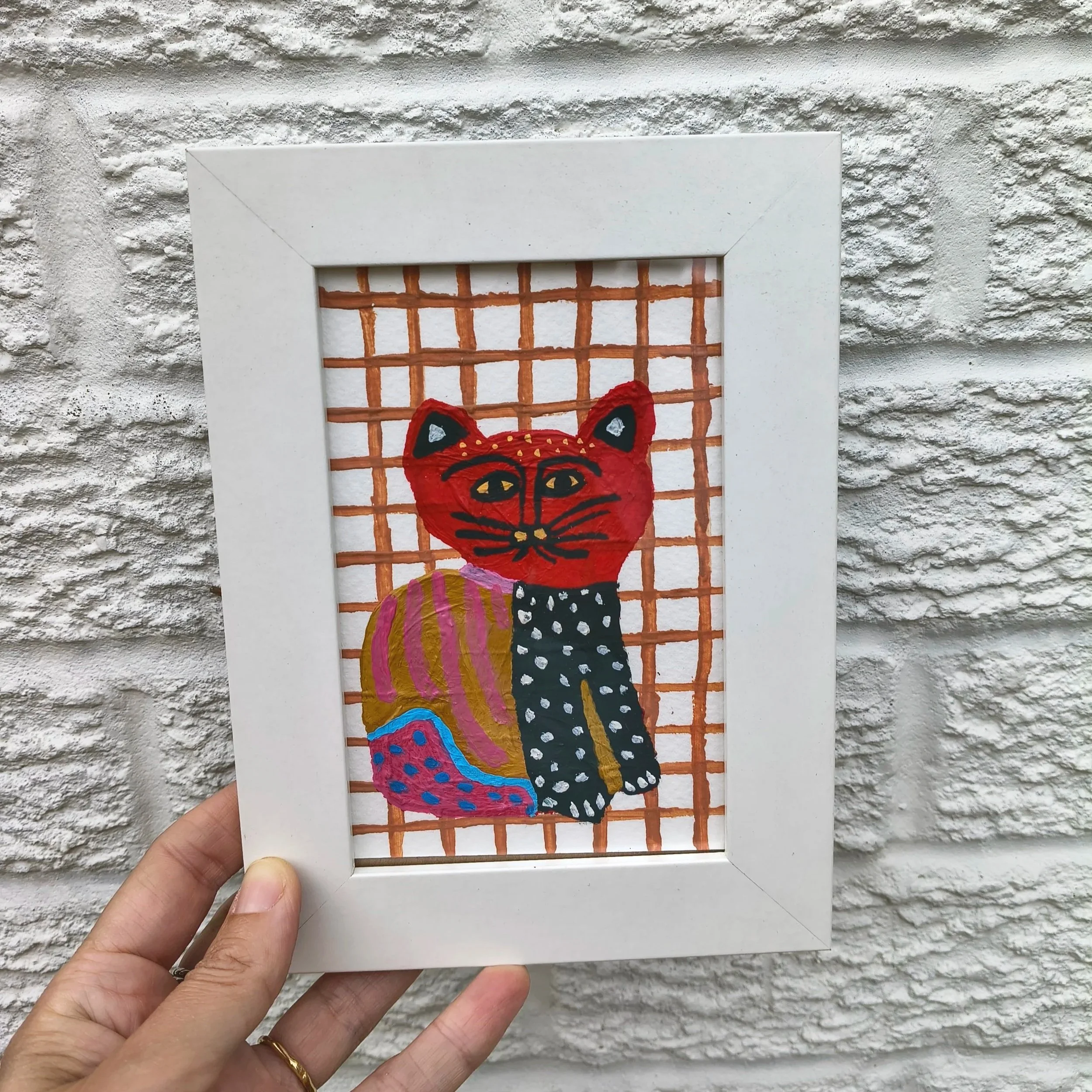 Ruby Cat Acrylic Painting on white wall