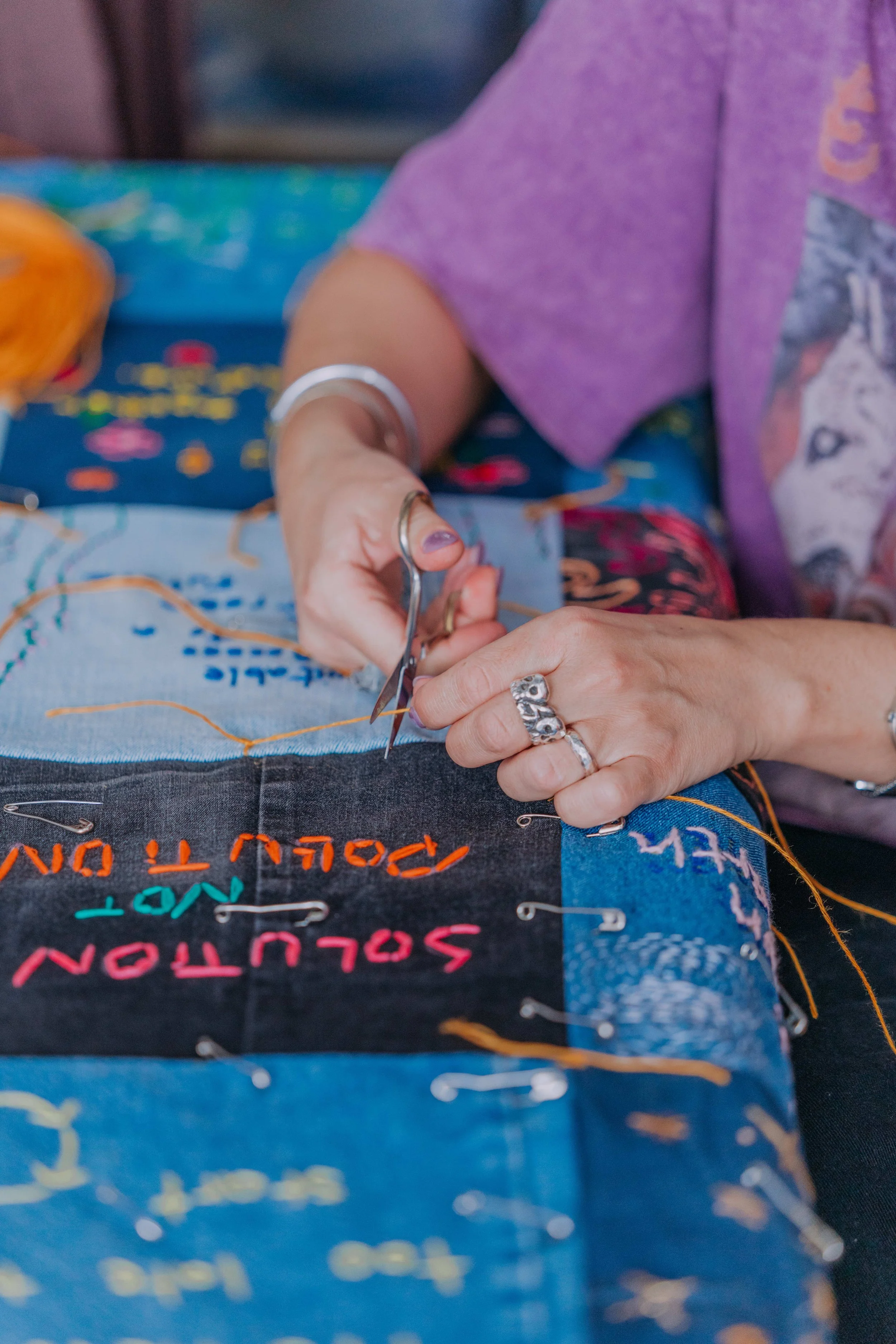Tal Fitzpatrick and Melissa Spratt making 'Crafting for Climate: A Community Quilt' for CRS