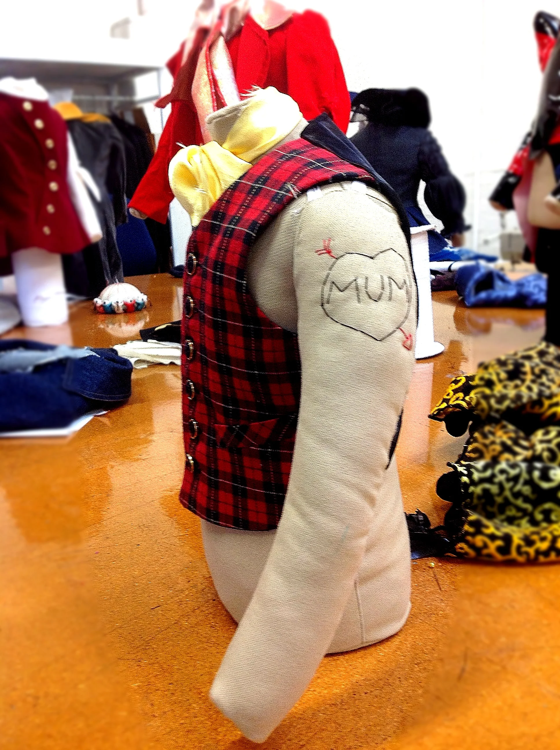 Laura's dress stand and finished waistcoat with tattoo