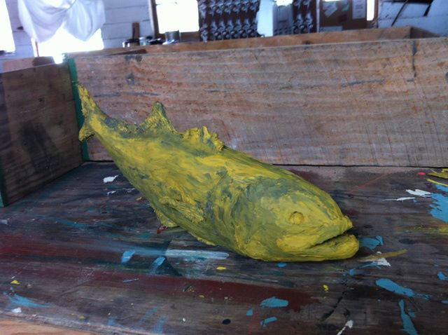 Final Clay fish with the flask used to make the two part sand resin mold in the background
