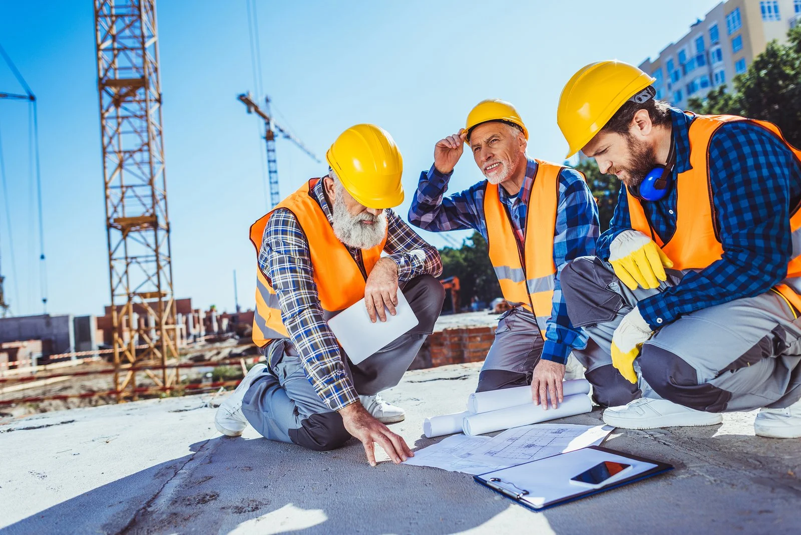 bigstock-Construction-Workers-With-Buil-210661174.jpeg