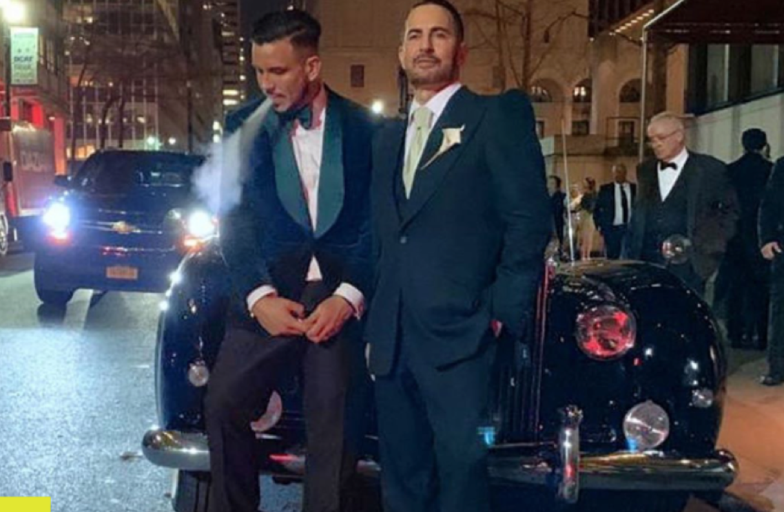 Vaping on the hood of a Rolls; image via The Baller.