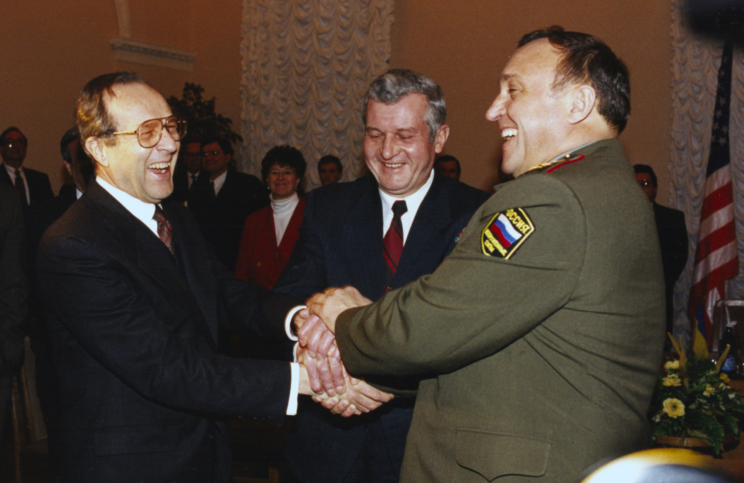 An historic meeting in Kiev, Ukraine: the defense ministers from the United States, Russia, and Ukraine all join hands before a discussion, 4 January 1996.
