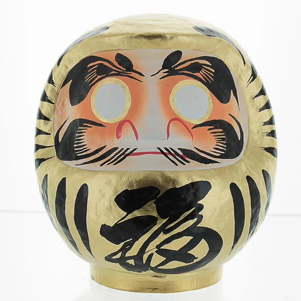 gold daruma doll meaning