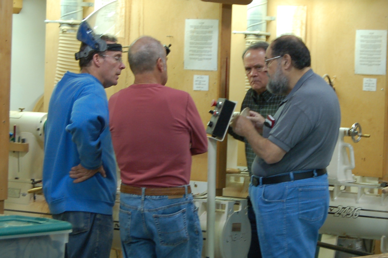  Bryan, Phil Hauser, Linford Sine and Joe Seltzer discuss the finer points of coring. 