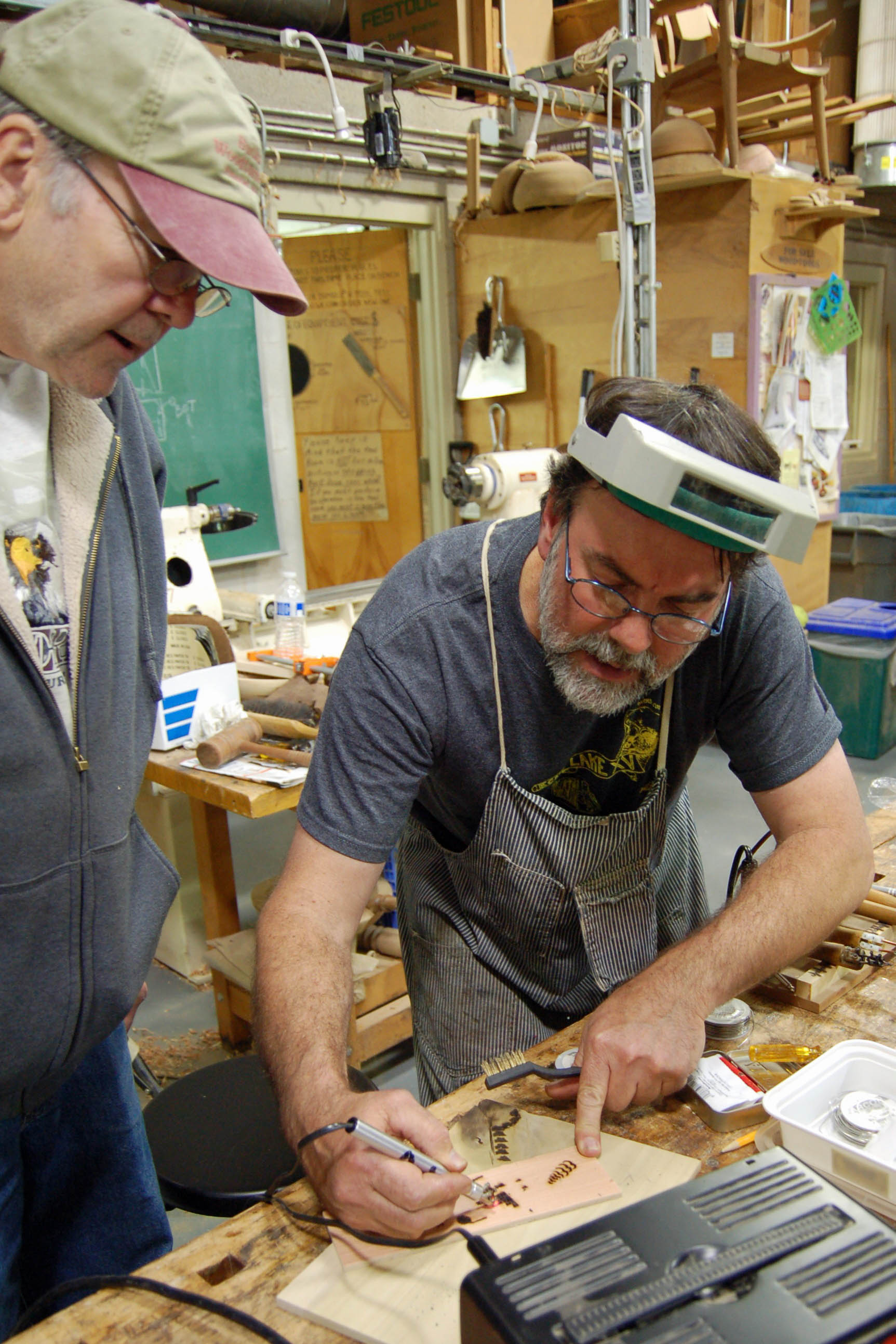Michael gives a little one-on-one instruction to Tom.