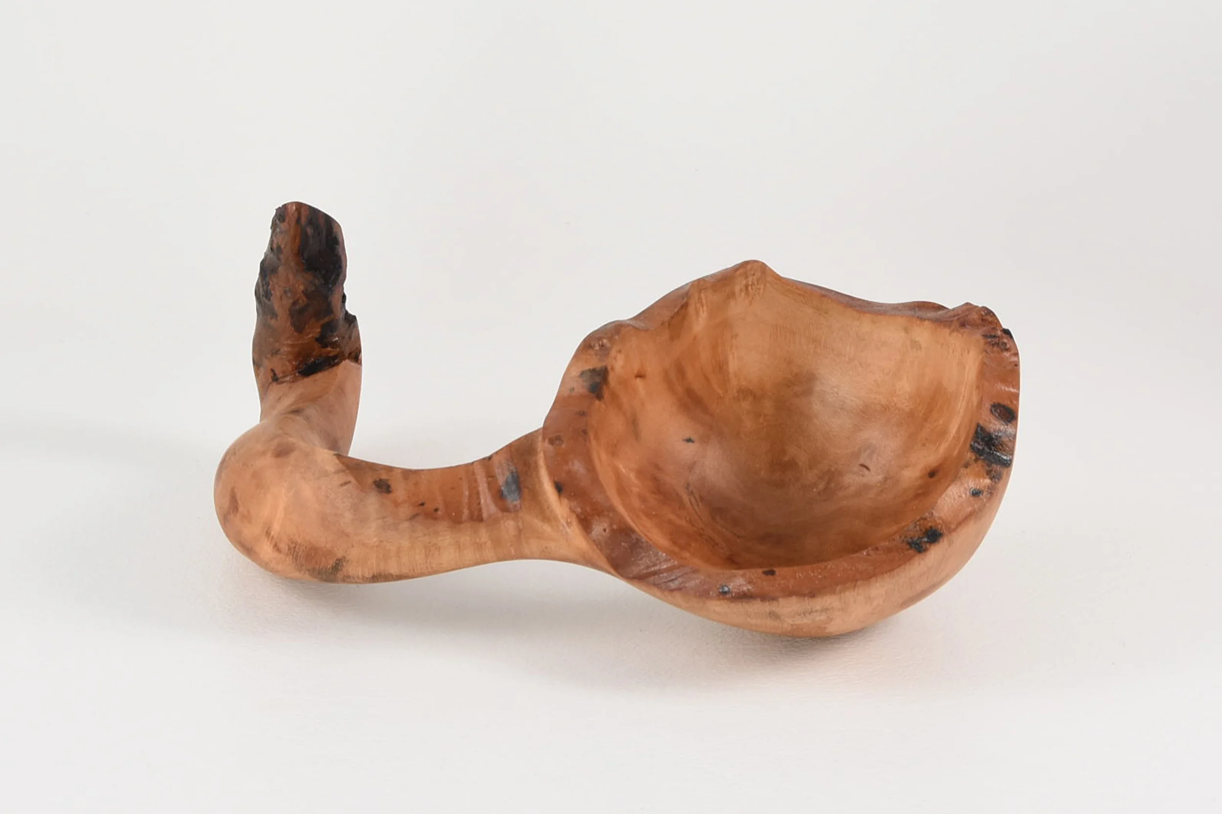 My spoon is carved from a branch of Madrone that has a natural hook so you can hang it on a tree! -Bryan Richardson