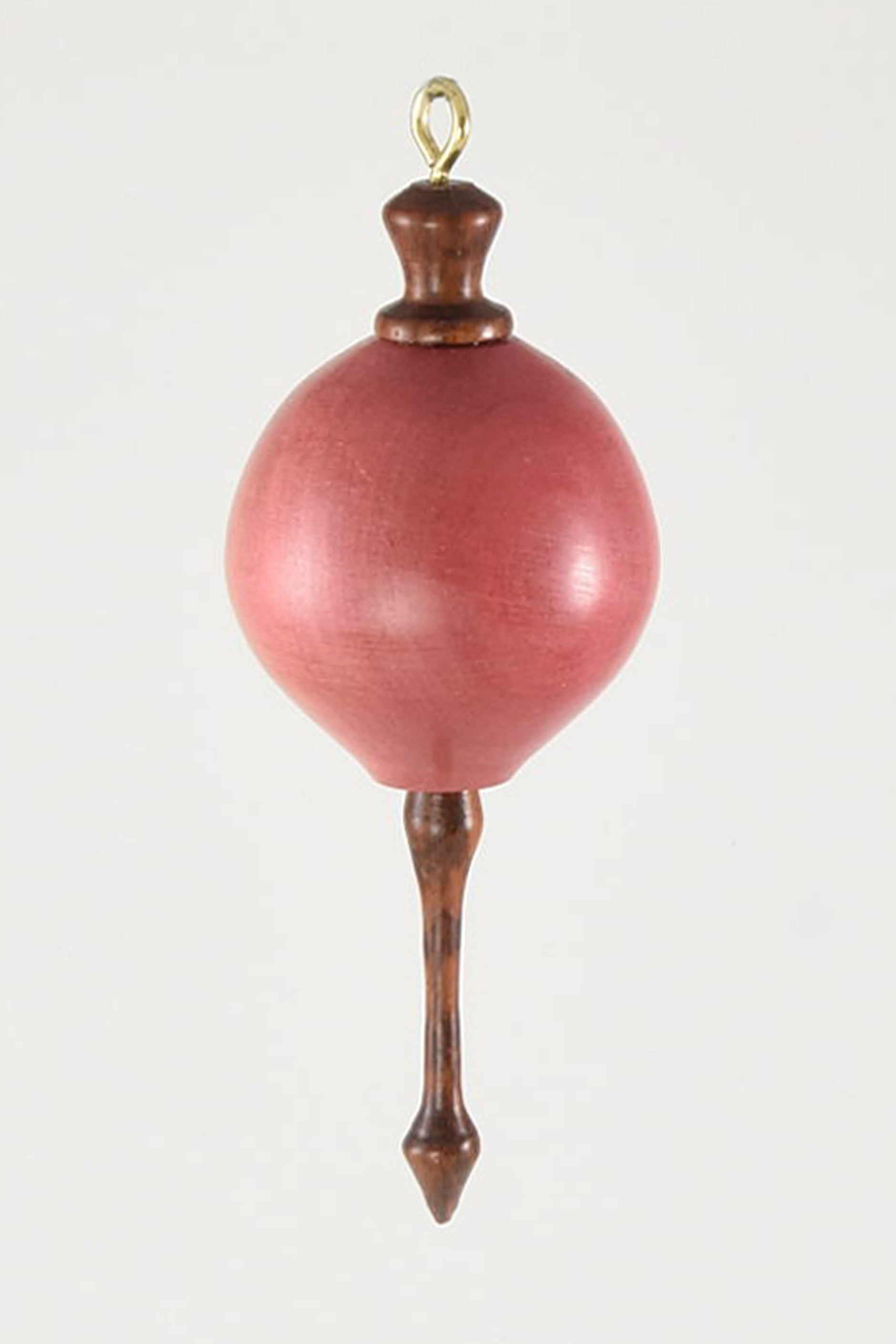My Pollyanna is made from two of the rarest woods in the world, body is Pink Ivory Wood and the top and finial are Snakewood. I hollowed it and then it finished with Renaissance Wax and a little regular wax for shine. -Joe Seltzer