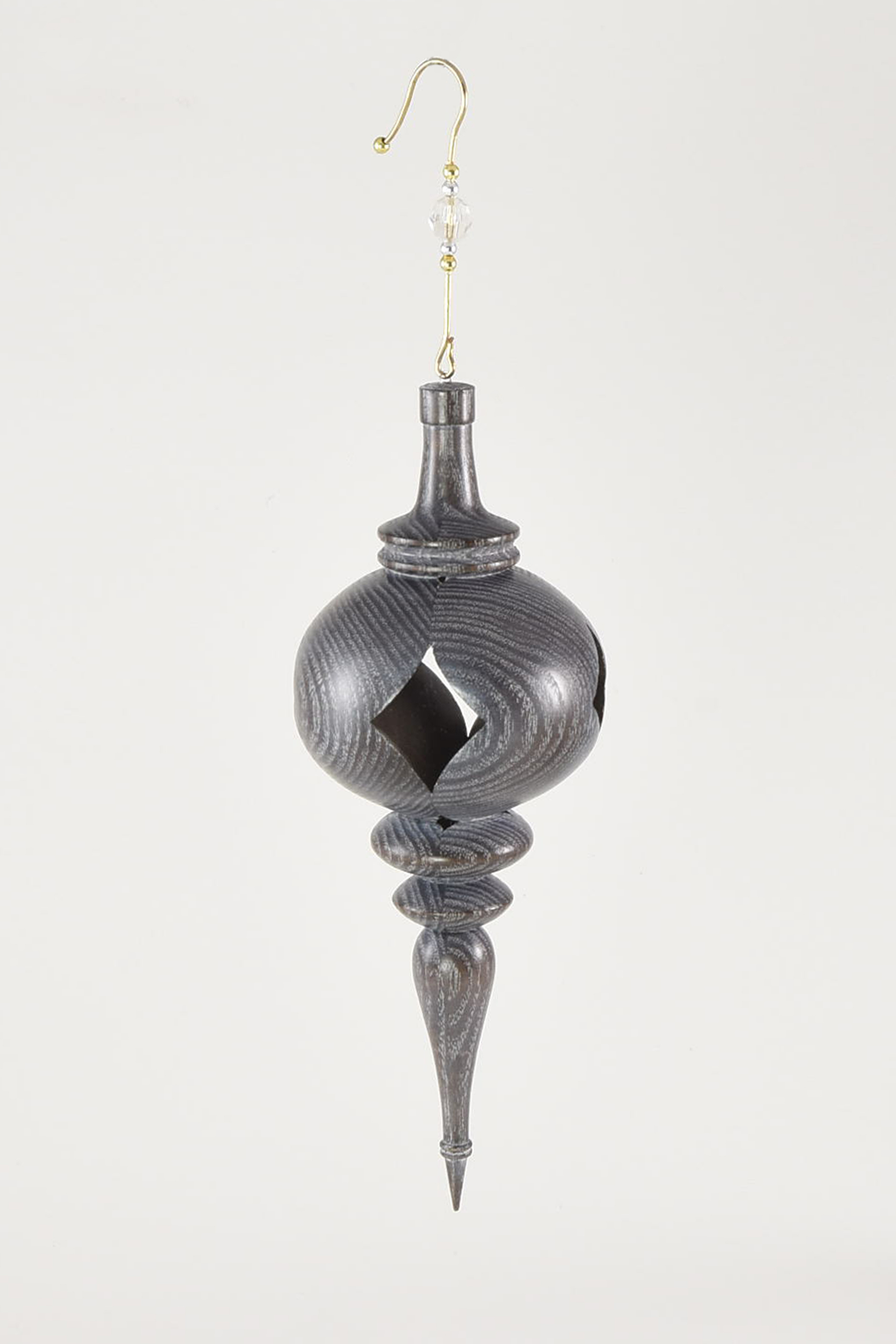 This inside-out ornament is made from sassafras which was then dyed with a Transtint dye. I then used liming wax and buffed it out to highlight the wood grain. -Linford Sine
