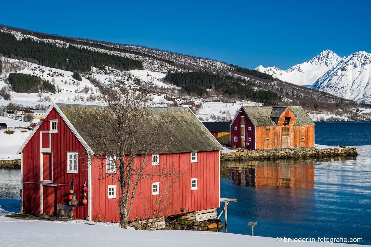@norway #lofoten #landscape #village #redhouse #orangehouse #farmhouse #fjordlandscape #water # ice # snow #silence #bluesky # mountains