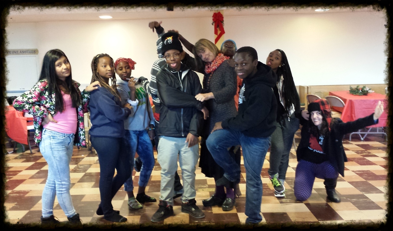 While baking cookies for a fundraiser, the youth group played several fun games including "statue". 