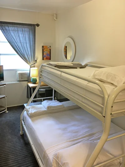 One of our double private rooms – all our rooms have bunk beds and come with a sink and mirror and equipped with an AC and heater.