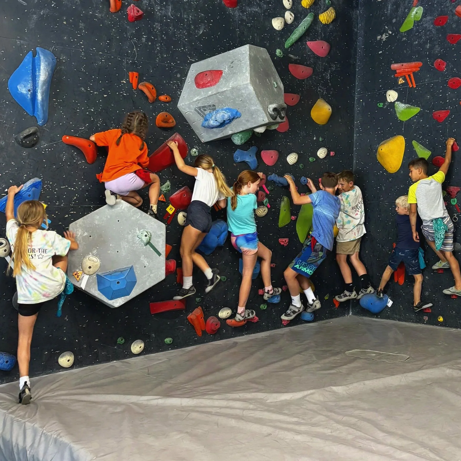 Kids climbing and having fun in Cliff Hangers at Shasta Rock Club