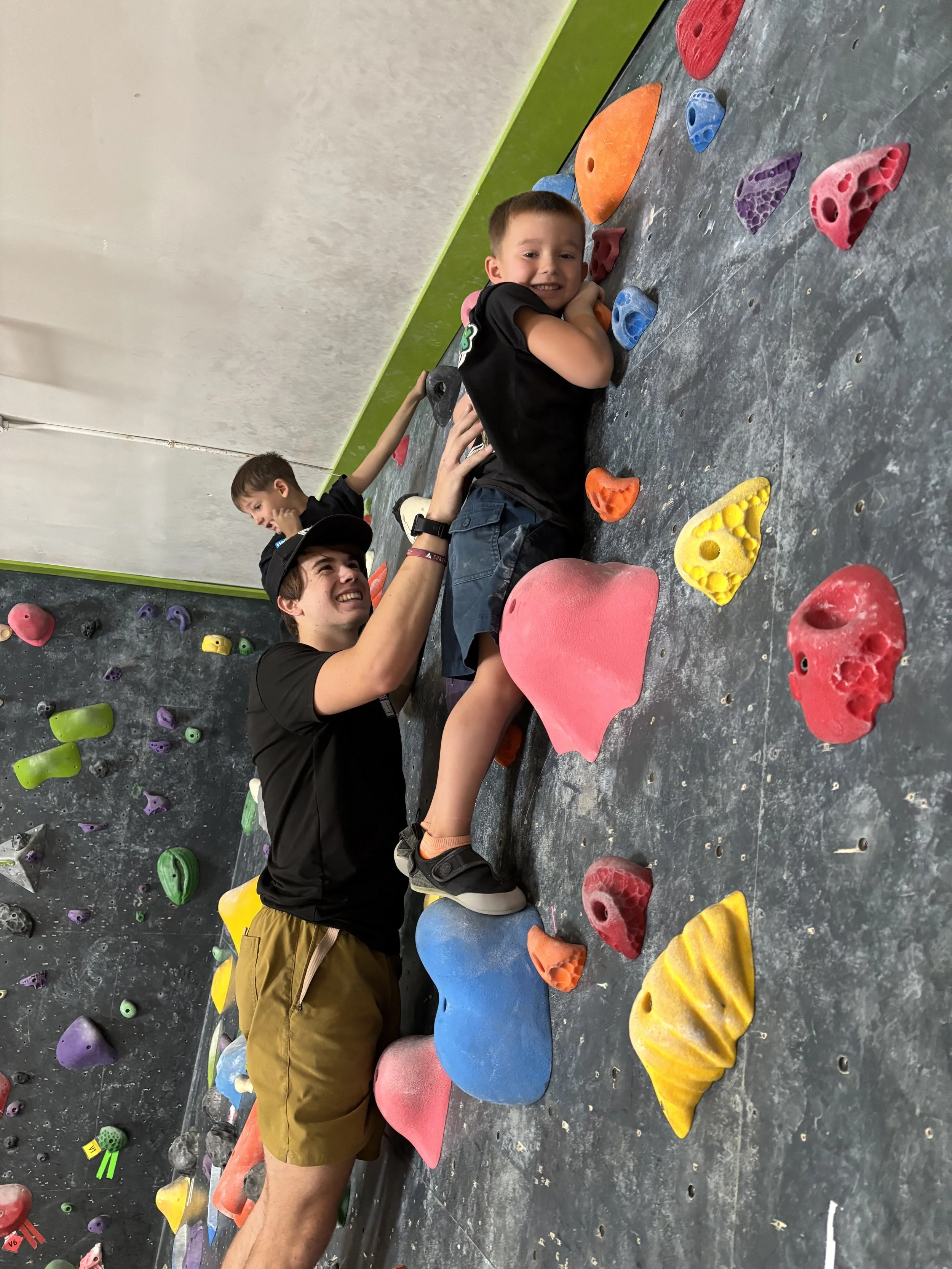 Young climber learning climbing skills in Base Campers at Shasta Rock Club