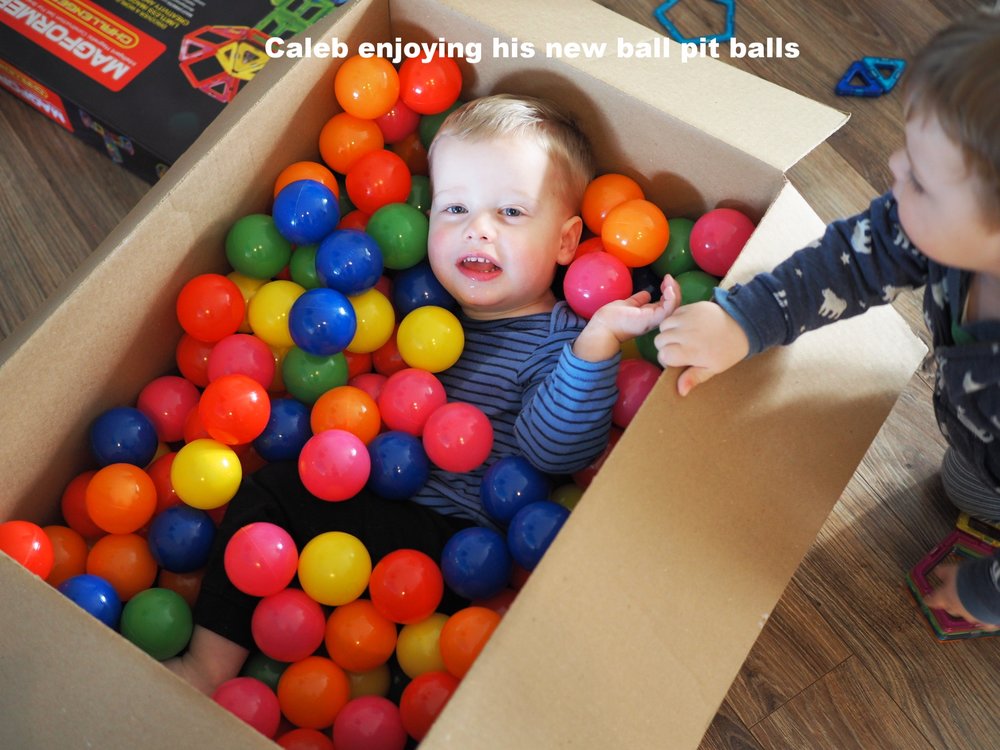 Caleb enjoying his new ball pit balls