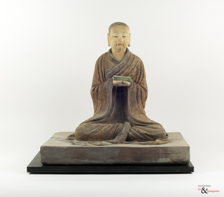 A Painted Clay Ming Dynasty Sculpture of a Luohan, c. 1368-1644