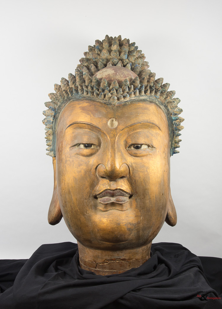 A Gilded and Painted Clay Ming Dynasty Head of Buddha, c. 1368-1645
